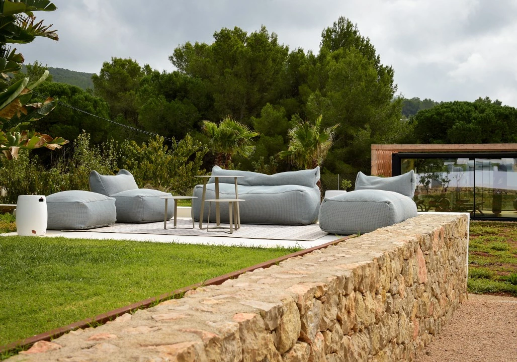 1680682115-Luxury real estate to rent Ibiza Villa Can Calypso luxury service living room outside.webp